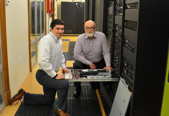 Image of student and faculty member collaborating in a lab.